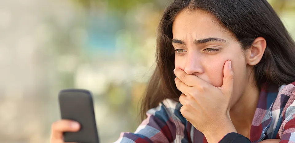 girl on mobile device watching tik toks