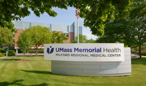 The front sign for UMass Memorial Health - Milford Regional Medical Center on a sunny day.