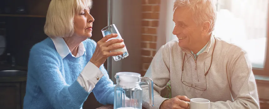 elderly couple enjoying breakfast