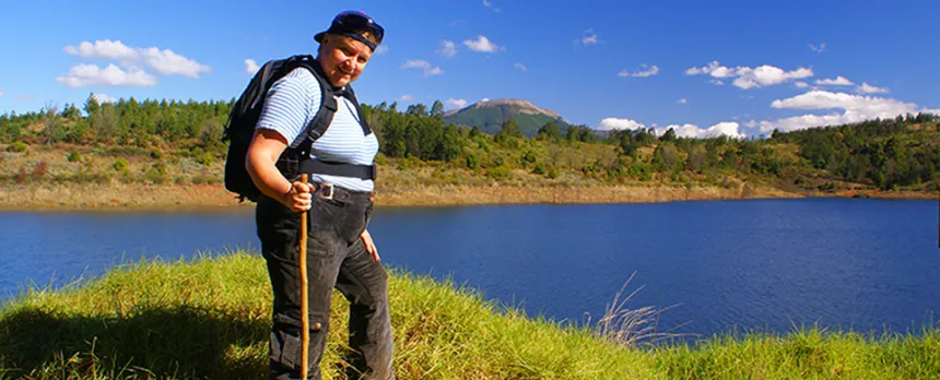 woman hiking with walking stick