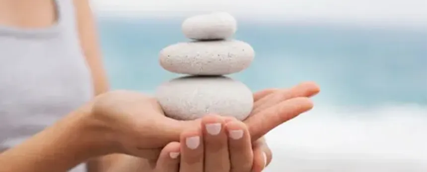women practicing mindfulness on beach